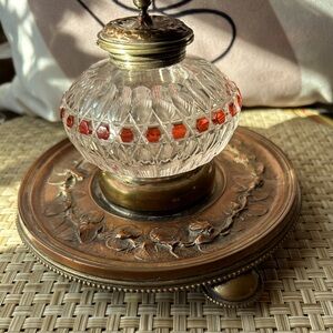 Vintage cut glass inkwell with brass top and stand.